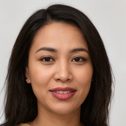 Joyful white young-adult female with long  brown hair and brown eyes