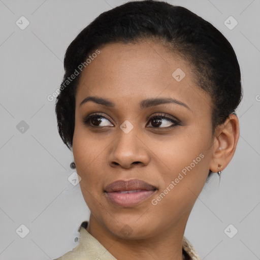 Joyful black young-adult female with short  black hair and brown eyes