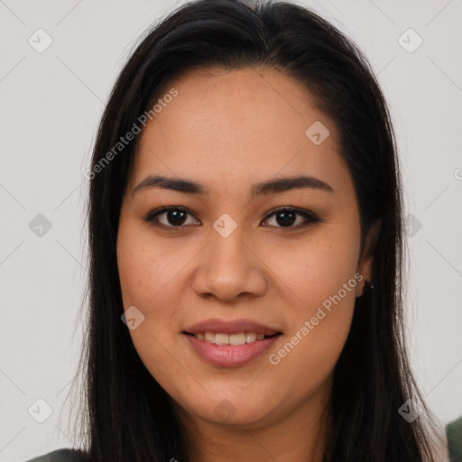 Joyful latino young-adult female with long  brown hair and brown eyes