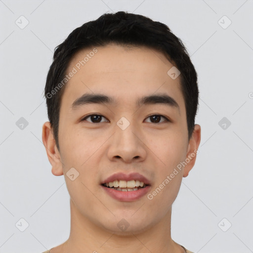 Joyful asian young-adult male with short  black hair and brown eyes