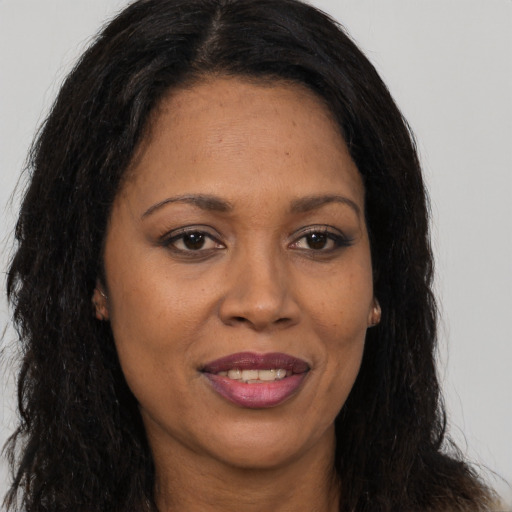 Joyful asian adult female with long  brown hair and brown eyes
