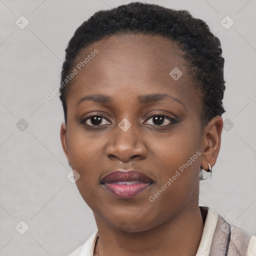 Joyful black young-adult female with short  brown hair and brown eyes