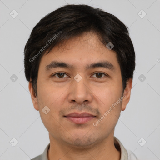 Joyful white young-adult male with short  black hair and brown eyes