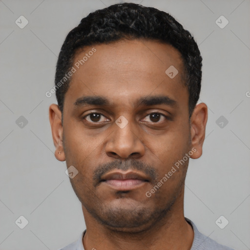 Neutral latino young-adult male with short  black hair and brown eyes