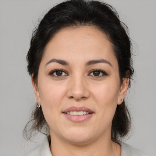 Joyful white young-adult female with medium  brown hair and brown eyes