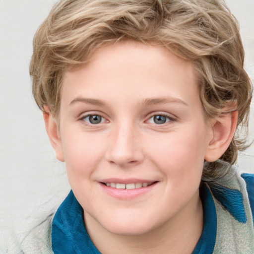 Joyful white child female with short  brown hair and blue eyes