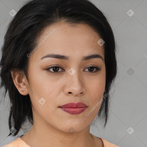 Joyful latino young-adult female with medium  black hair and brown eyes