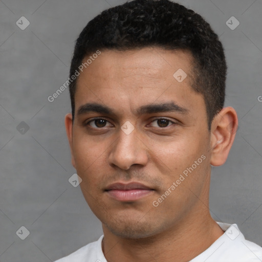 Neutral latino young-adult male with short  black hair and brown eyes