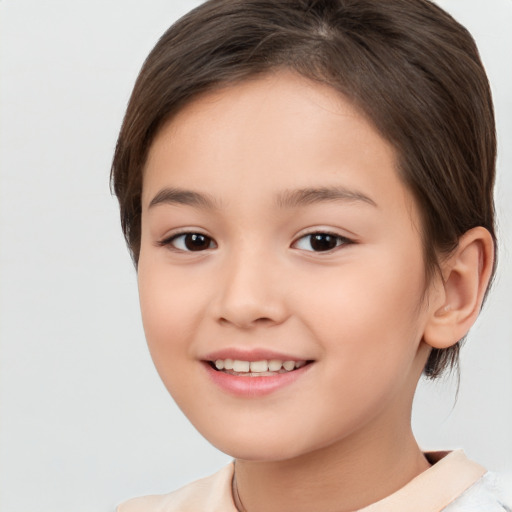 Joyful white child female with medium  brown hair and brown eyes