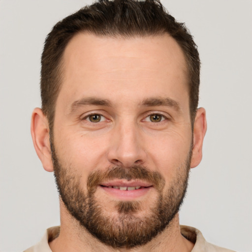 Joyful white adult male with short  brown hair and brown eyes