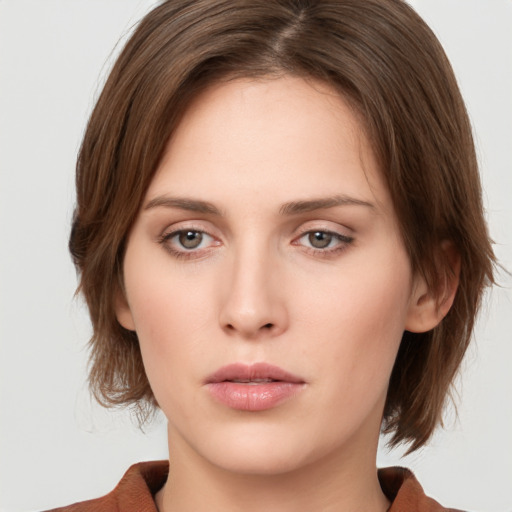 Neutral white young-adult female with medium  brown hair and brown eyes