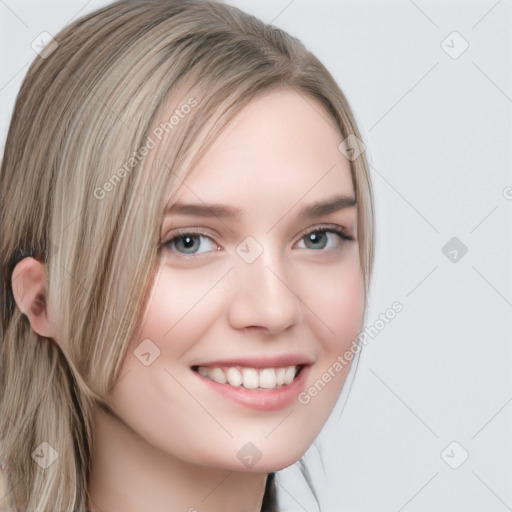 Joyful white young-adult female with long  brown hair and blue eyes