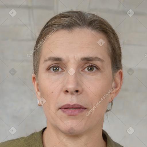 Joyful white adult female with short  brown hair and grey eyes