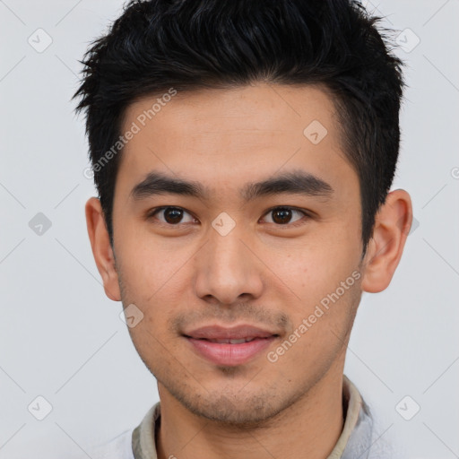 Joyful asian young-adult male with short  brown hair and brown eyes