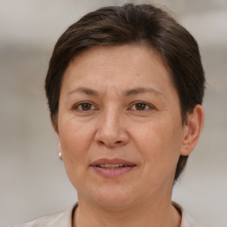 Joyful white adult female with short  brown hair and brown eyes