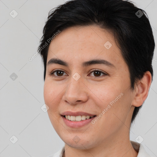 Joyful white young-adult female with short  brown hair and brown eyes