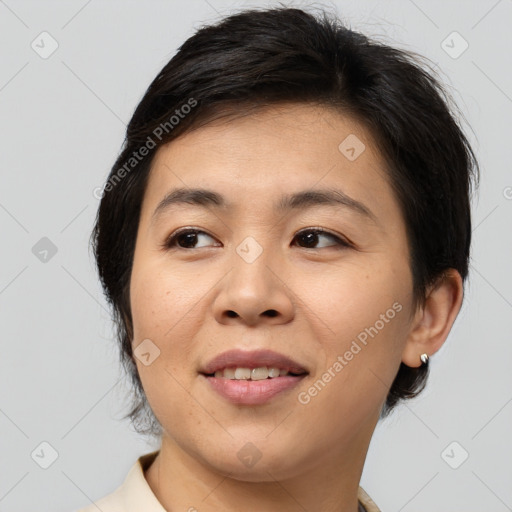 Joyful asian young-adult female with medium  brown hair and brown eyes