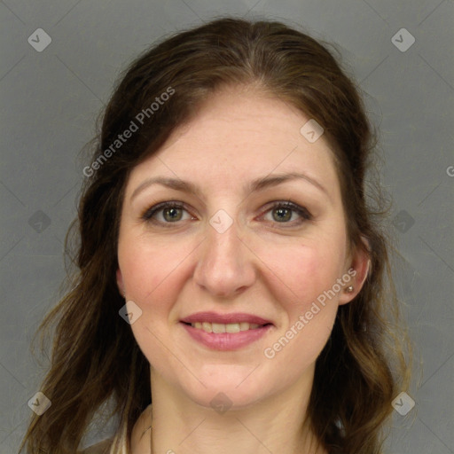 Joyful white adult female with long  brown hair and grey eyes