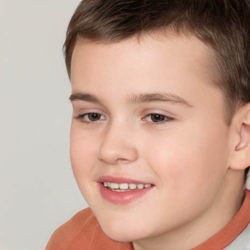 Joyful white child male with short  brown hair and brown eyes