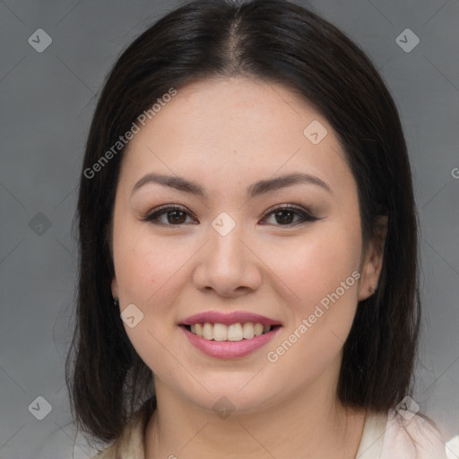 Joyful asian young-adult female with long  brown hair and brown eyes