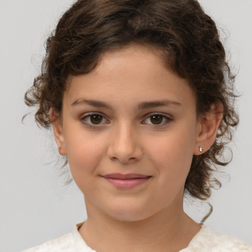 Joyful white child female with medium  brown hair and brown eyes