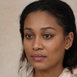 Joyful black young-adult female with medium  brown hair and brown eyes