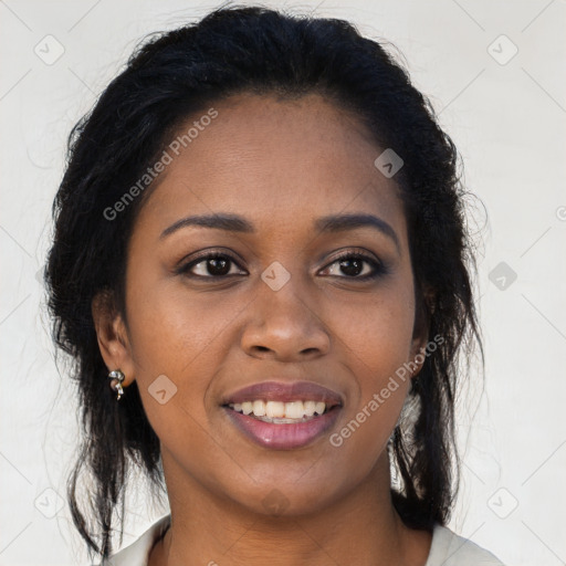 Joyful black young-adult female with long  brown hair and brown eyes