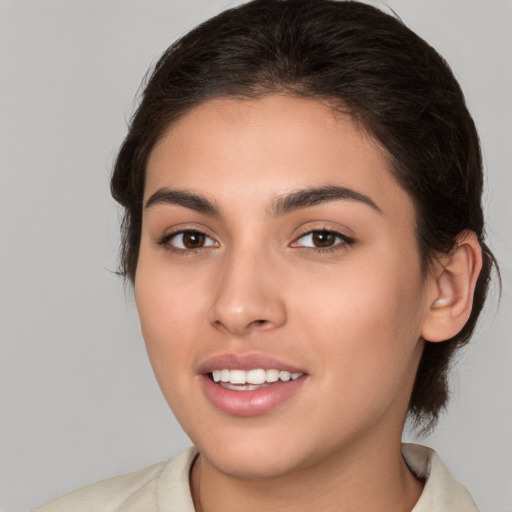 Joyful white young-adult female with medium  brown hair and brown eyes