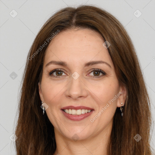 Joyful white adult female with long  brown hair and brown eyes