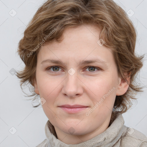 Joyful white young-adult female with medium  brown hair and blue eyes