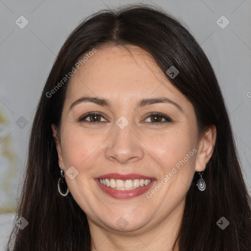 Joyful white adult female with long  brown hair and brown eyes