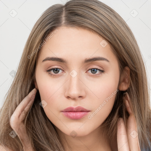 Neutral white young-adult female with long  brown hair and brown eyes