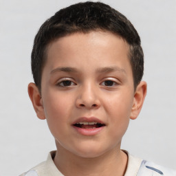 Joyful white child male with short  brown hair and brown eyes