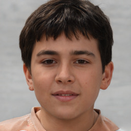 Joyful white child male with short  brown hair and brown eyes