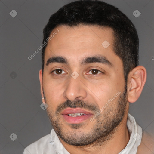 Joyful white young-adult male with short  black hair and brown eyes