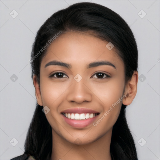 Joyful latino young-adult female with long  black hair and brown eyes