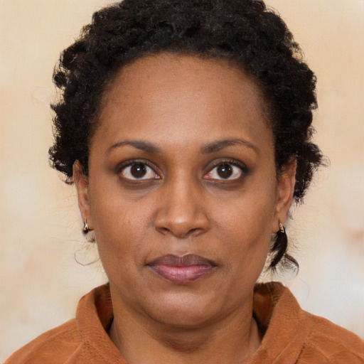 Neutral black young-adult female with medium  brown hair and brown eyes