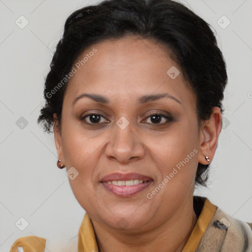 Joyful latino adult female with medium  brown hair and brown eyes