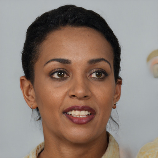 Joyful black young-adult female with medium  brown hair and brown eyes