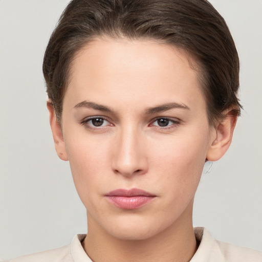 Neutral white young-adult female with short  brown hair and brown eyes