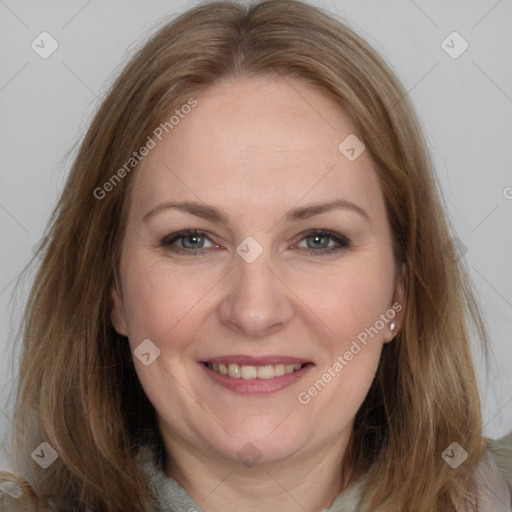 Joyful white adult female with long  brown hair and grey eyes