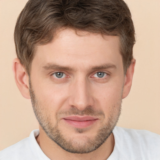 Joyful white young-adult male with short  brown hair and brown eyes