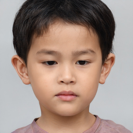 Neutral asian child male with short  brown hair and brown eyes