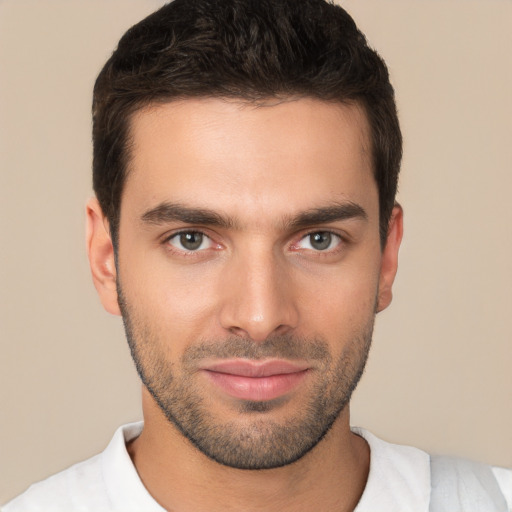 Joyful white young-adult male with short  brown hair and brown eyes