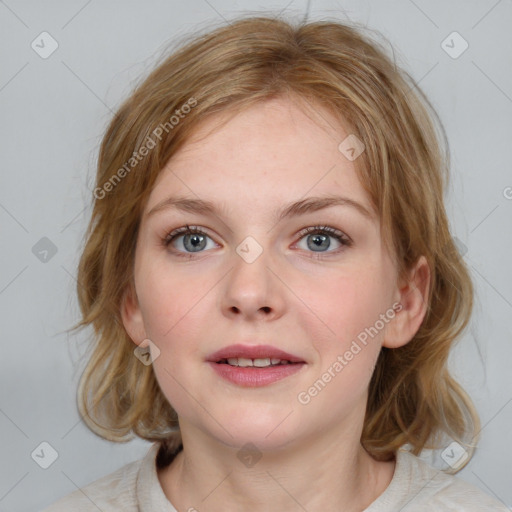 Joyful white young-adult female with medium  brown hair and blue eyes