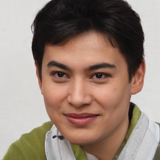 Joyful asian young-adult male with short  brown hair and brown eyes