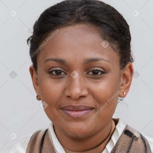 Joyful black young-adult female with short  brown hair and brown eyes