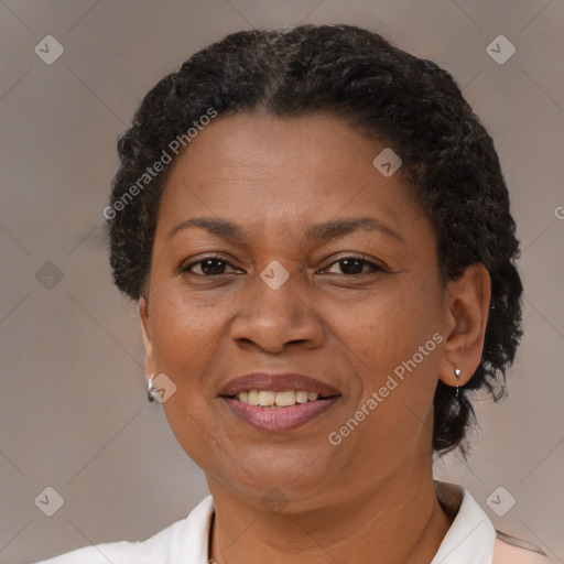 Joyful black adult female with short  brown hair and brown eyes