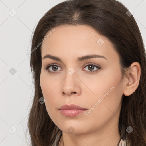 Neutral white young-adult female with long  brown hair and brown eyes