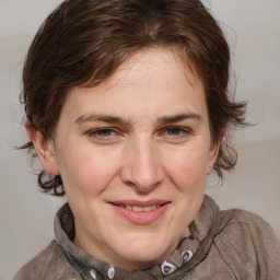 Joyful white adult female with medium  brown hair and grey eyes